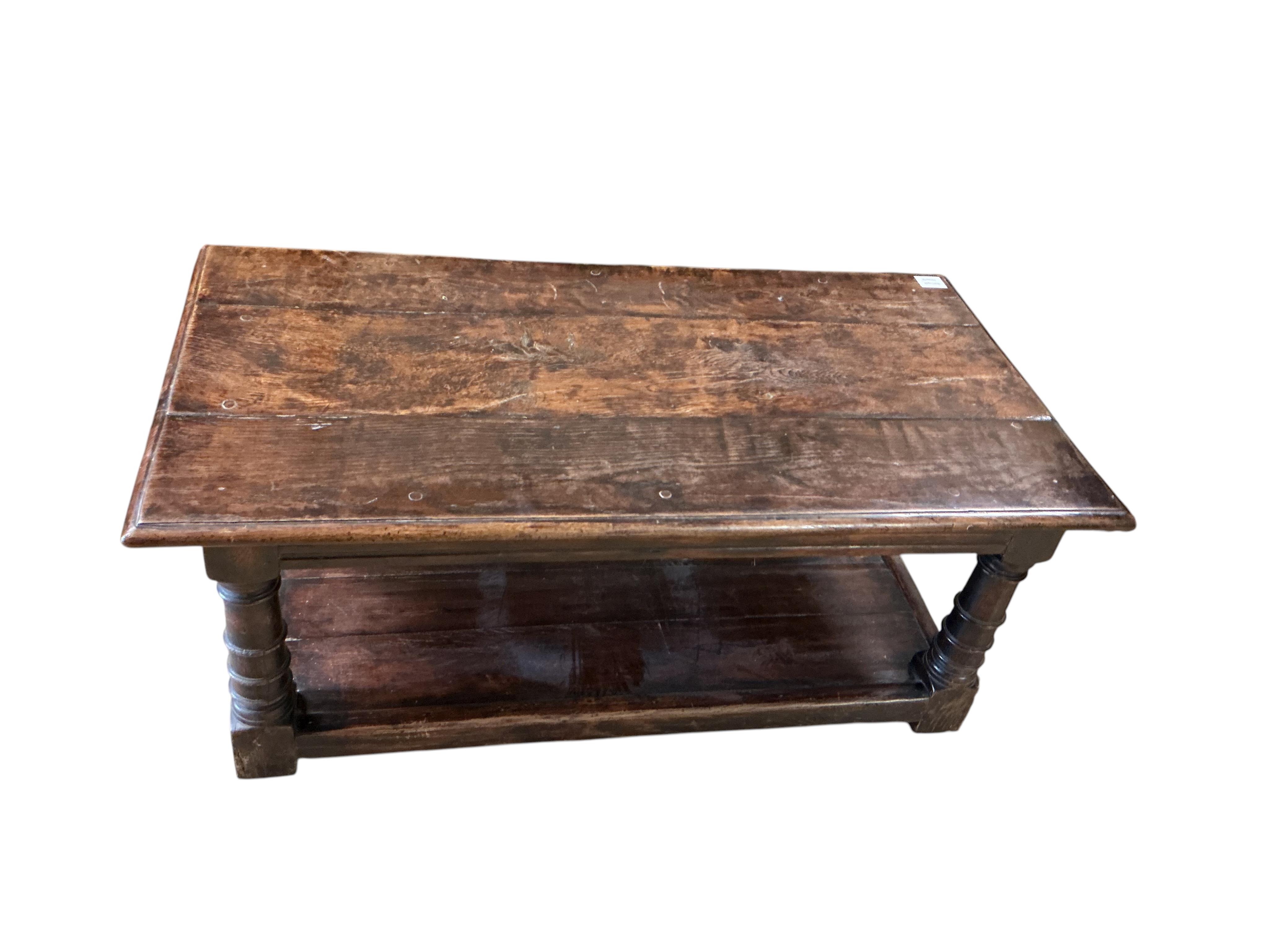 A 17th century style rectangular oak two tier coffee table, width 106c, depth 55cm, height 43cm